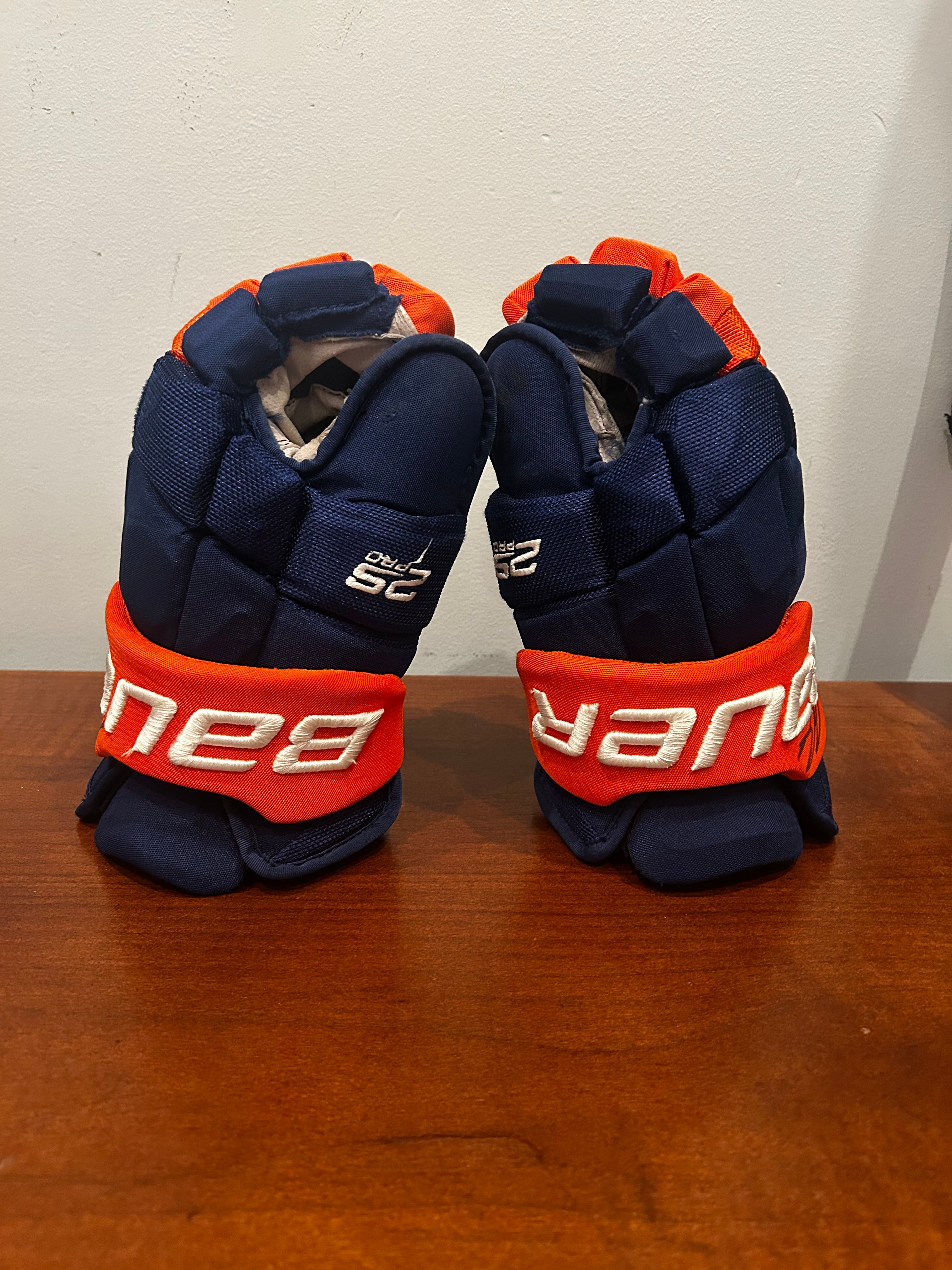 Ryan Pulock game used gloves signed