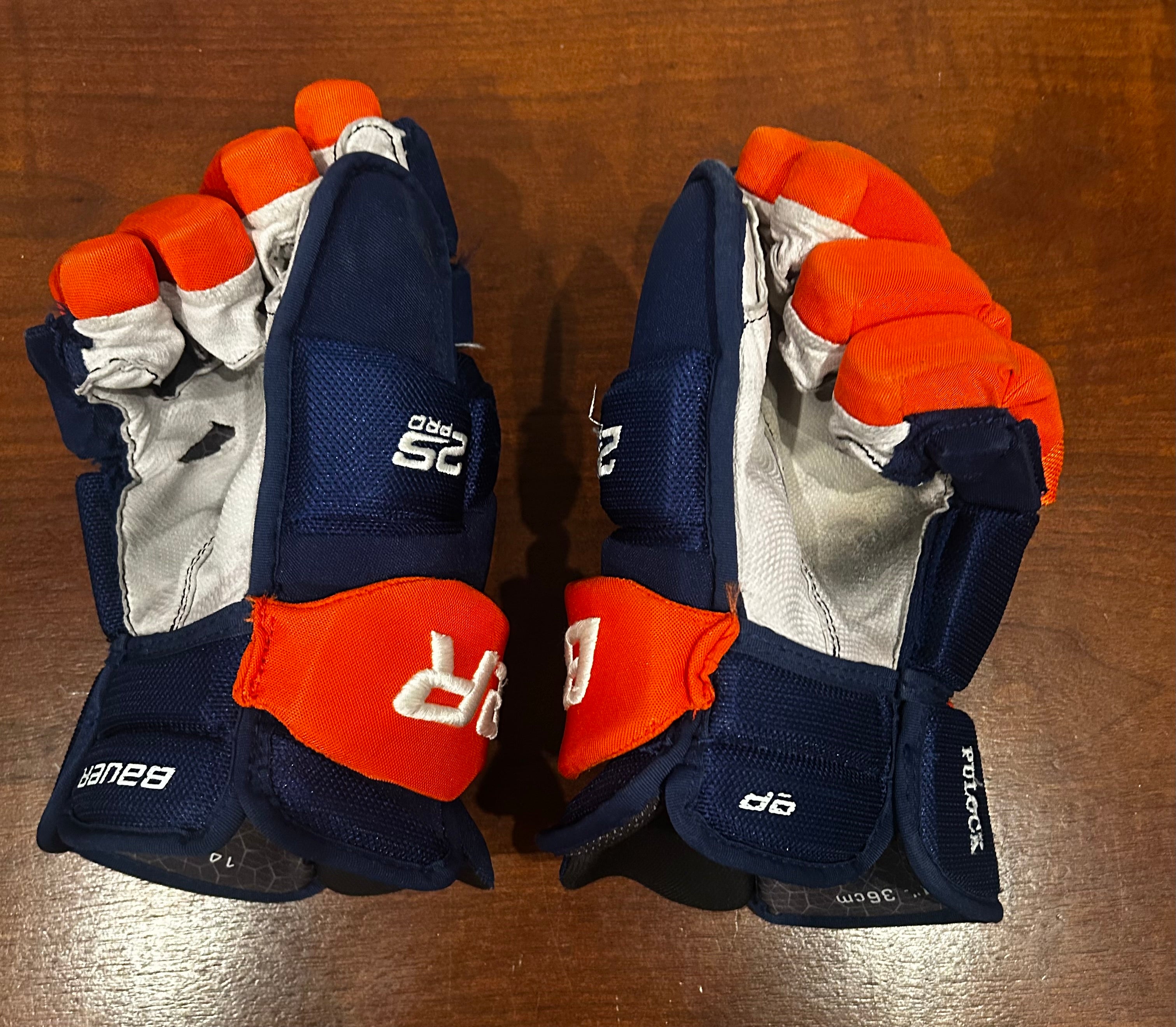 Ryan Pulock game used gloves signed