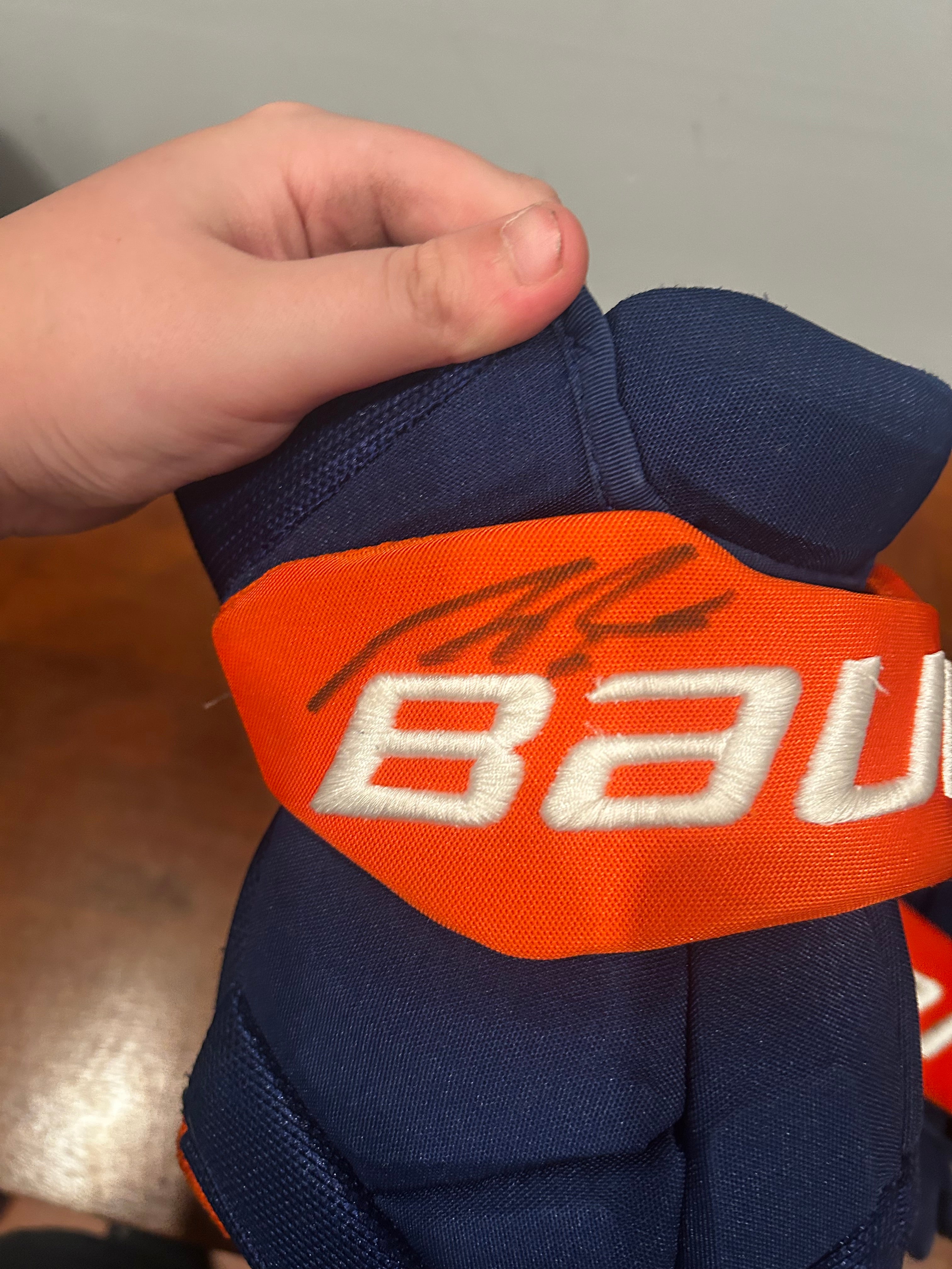 Ryan Pulock game used gloves signed
