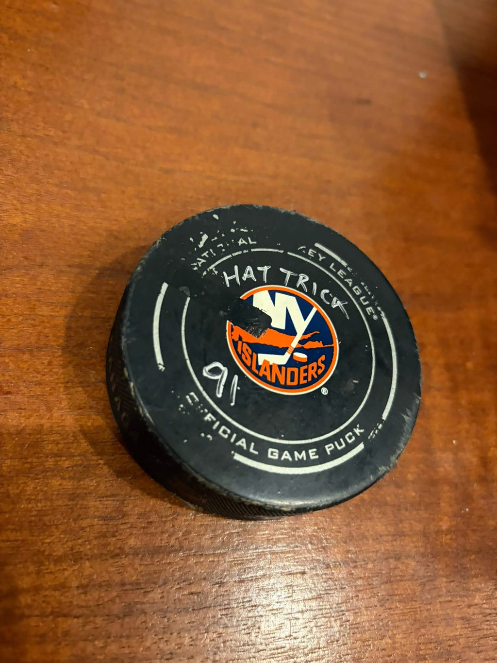John Tavares game used gloves with hat-trick puck.